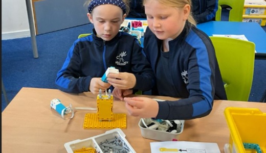 Y4 children enjoying their robotics workshop.