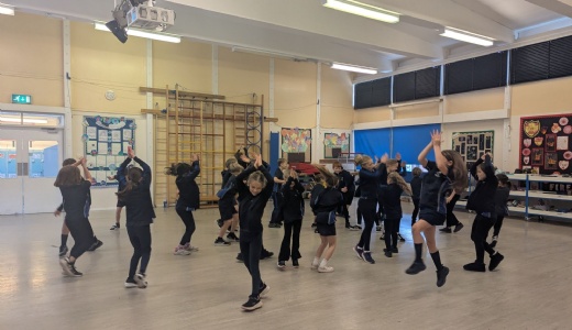 Picture showing Y4 children participating in their Diwali dance.